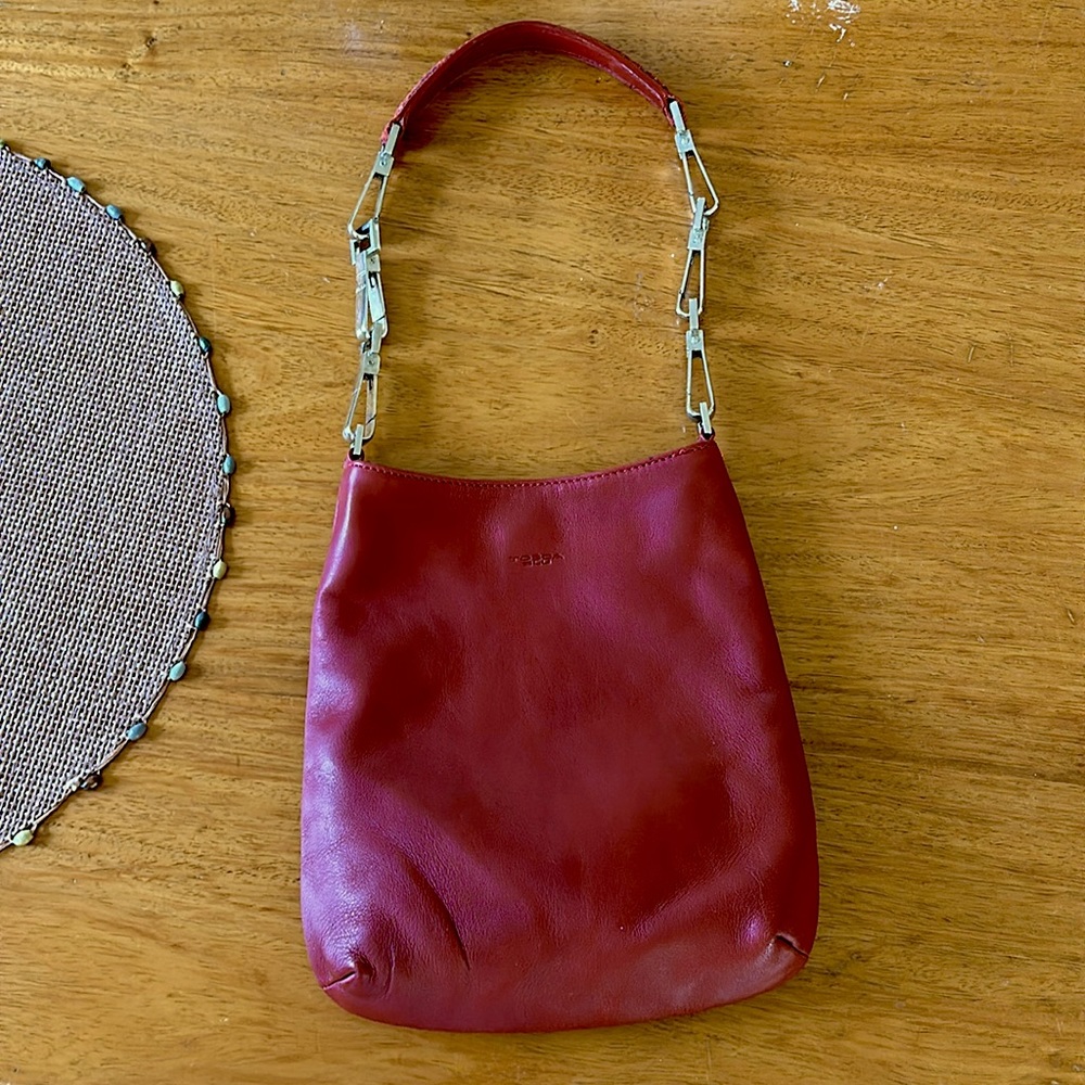 Tosca Blu bag true red animal print handle length adjusts with links shown.